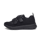 A single black school shoe with Velcro straps and a textured sole designed for children.